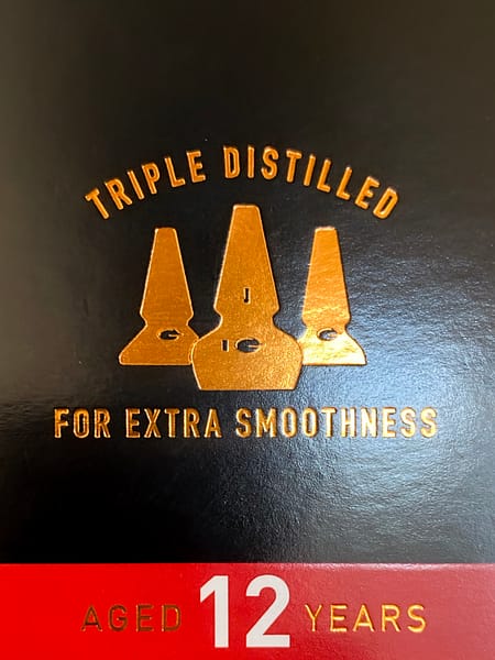 Detail of the Auchentoshan 12 year old box calling out the triple distillation