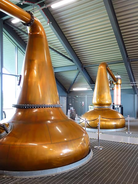 The Lagg distillery stills, onion shaped wash still left and lantern shaped spirit still, right