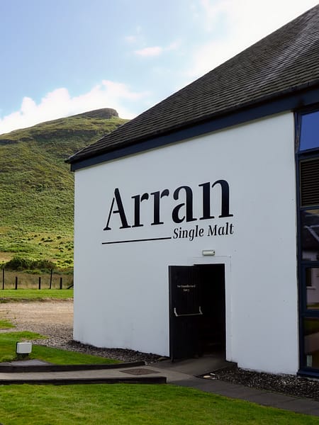 Lochranza distillery external wall with Arran logo