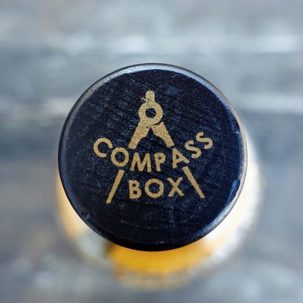 Compass Box Artist Blend stopper, carrying the brand logo
