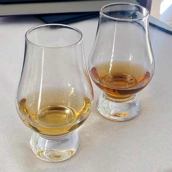 Two Glencairn glasses holding different batches of Campbeltown Loch: the lighter Batch 22/150 (left) vs the darker Batch 23/122 (right)