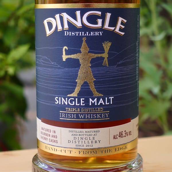 Dingle Single Malt label depicting the wrenboy mascot and stating the whiskey is triple distilled