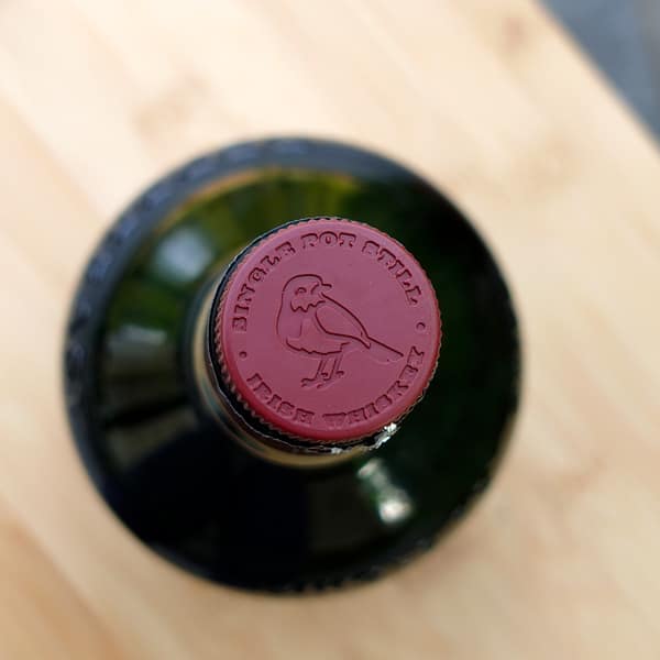 Redbreast 12 year old whisky cap showing a stylised red robin