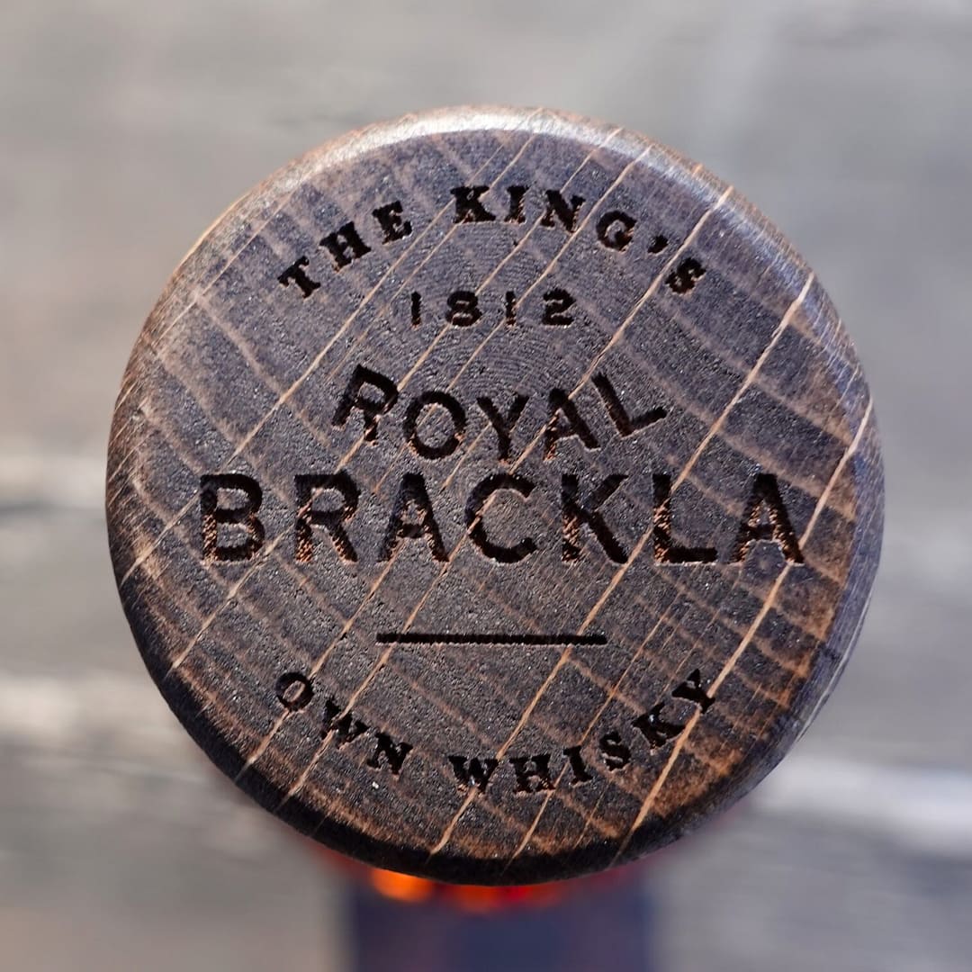 Royal Brackla 12 wooden stopper carrying the motto "The King's own whisky"