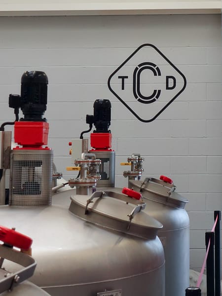 Detail of Clydeside's distillery washbacks and distillery logo on the wall