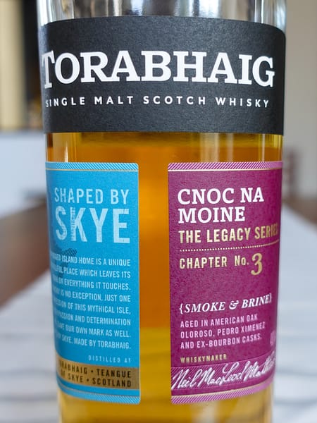 Torabhaing Cnoc Na Moine label made up of three paper panel leaving a negative space capital T in the middle