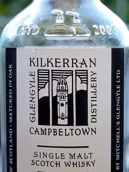 Kilkerran 12 year old label detail showing the distillery logo depicting the Lorne and Lowland Church tower