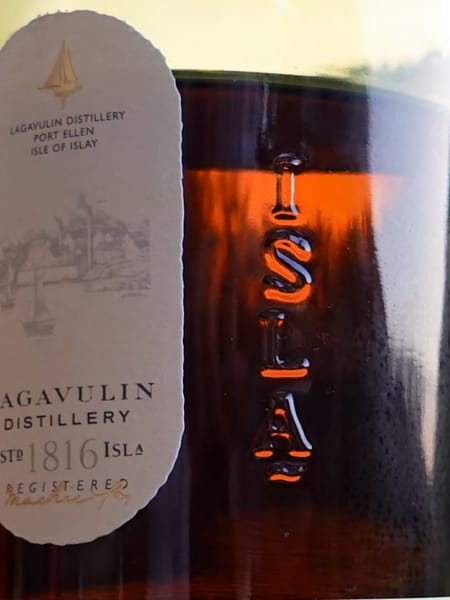 Light shining through a Lagavulin 16 year old bottle