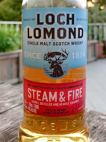 Loch Lomond Steam & Fire Label, split between the red bottom stip representing fire and the top light blue label, representing steam