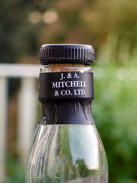 Springbank 10 cap detail showing the neck seal carrying the J. & A. Mitchell & Co Ltd text