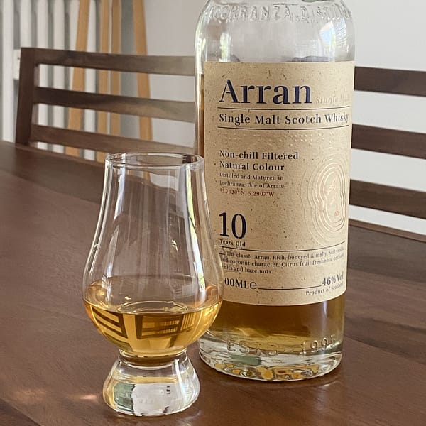Picture of an Arran 10 year old bottle with a Glencairn glass containing a dram of the whisky