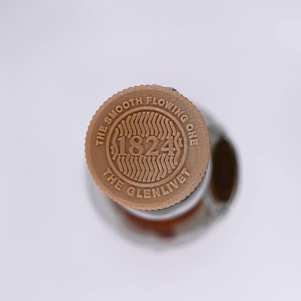 Picture of the Glenlivet 12 Double Oak cap showing the "smooth flowing one" motto
