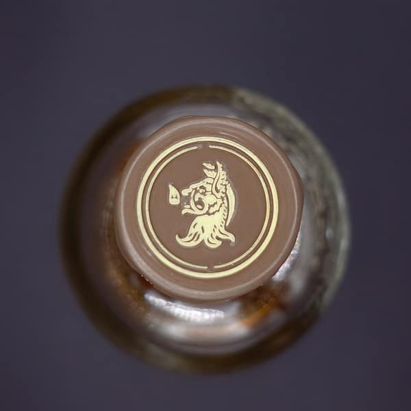 Tomatin Legacy bottle cap detail showing the heraldic wild boar head image