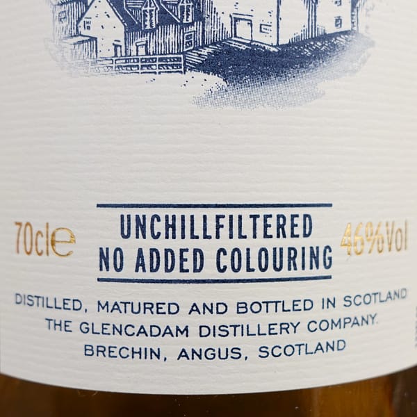 Detail of Glencadam's 10 year old label, indicating the whisky is unchillfiltered and has no added colouring