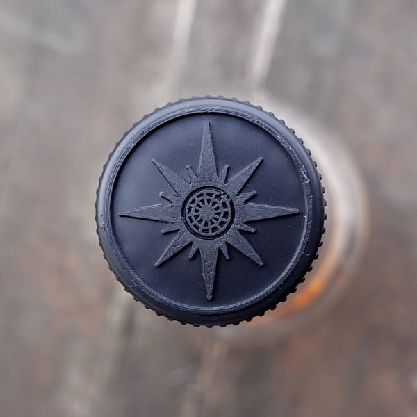 Stopper from the Old Pulteney 12 bottle depicting a a compass rose