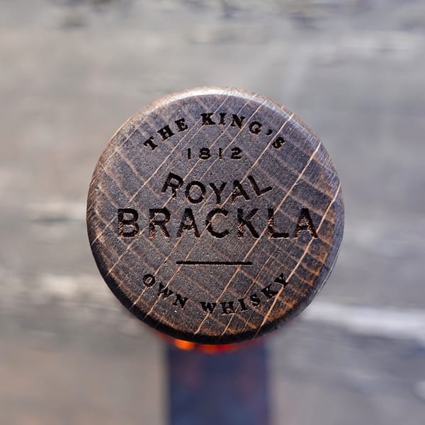 Royal Brackla 12 wooden stopper carrying the motto "The King's own whisky"