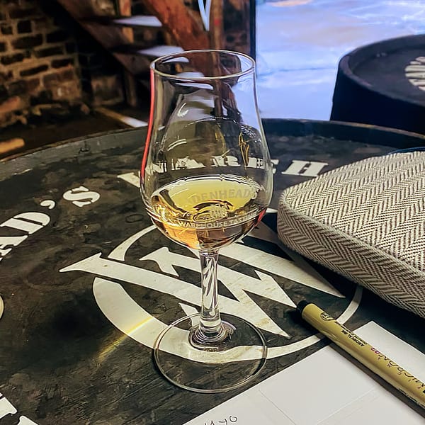 Cadenhead warehouse tasting - copita on top of a Cadenhead branded barrel