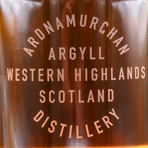 Detail of an Ardnamurchan whisky bottle showing the etched writing: Ardnamurchan Distillery, Argyll, Western Highlands, Scotland