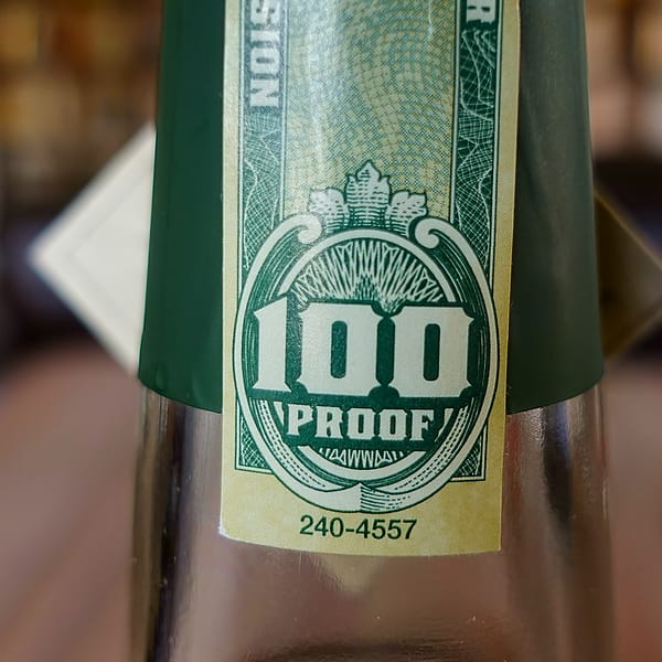 Henry McKenna Single Barrel Bottled-in-Bond 10 year old bottle seal detail showing the proof of the bottle, 100 proof