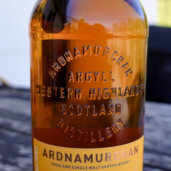 Ardnamurchan Sauternes bottle detail showing the embossed distillery name on the glass of the bottle