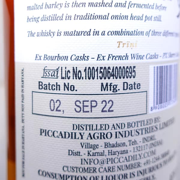 Indri Trini back label detail showing the batch number, 2, and the bottling date, September 2022