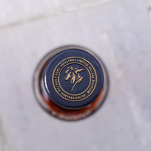 Indri Trini Cap seal detail showing the logo of the Piccadilly AIL company