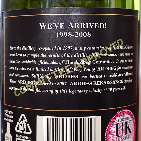 Ardbeg Renaissance bottle back label detailing the story of reopening the distillery and the series of whiskies released to mark the progress towards the first 10 year old fully distilled under the new management