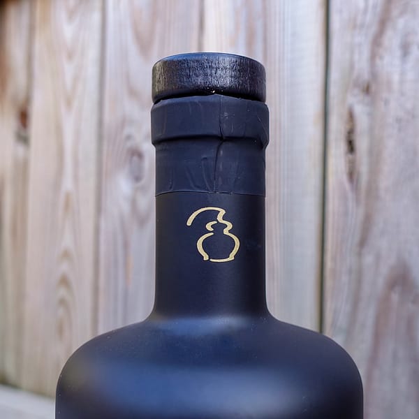 Stauning Floor Malted Rye Bottle Neck Detail - showing the Image of a Stylised Still on the Plastic Seal