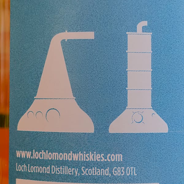 Loch Lomond Steam & Fire back label detail showing the pot still and straigt neck stills used at the distillery
