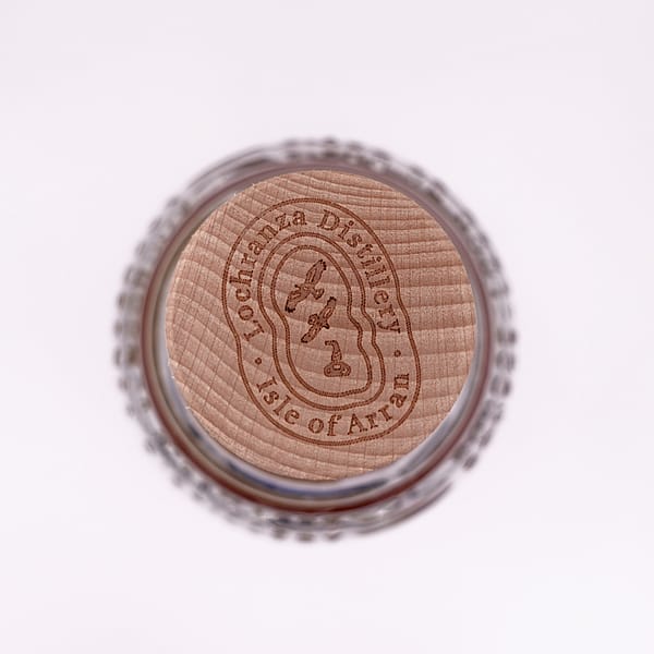 Detail of the Arran 10 year old bottle stopper showing two golden eagles and a pot still