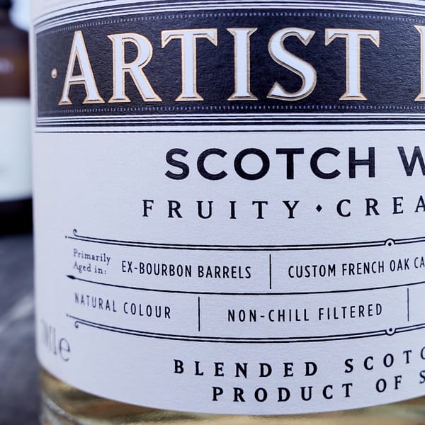 Detail of the Compass Box Artist Blend label indicating the use of Bourbon and custom French oak cask aged whisky in the blend & indicating no added colour and no chill filtration