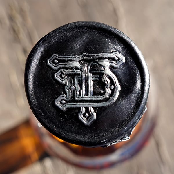 Tamdhu 12 year old cap seal carrying the stylised T and D letters