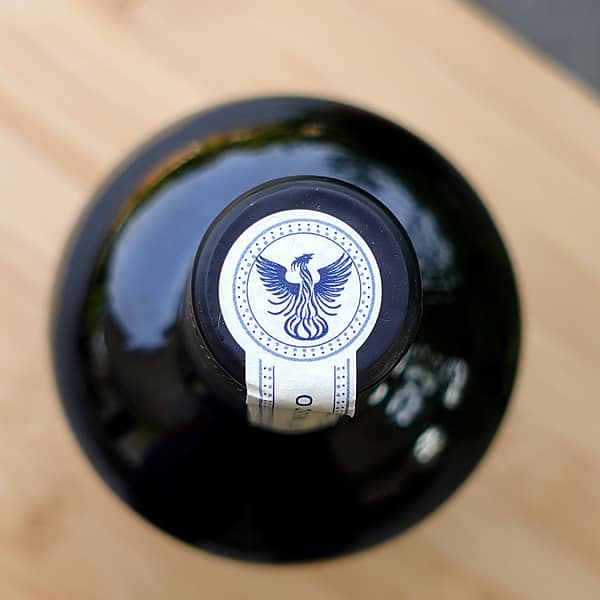 Teeling Single Pot Still whiskey cap seal showing the distillery logo of a phoenix raising from a pot still