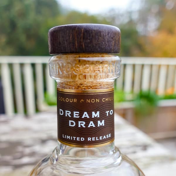 Kingsbarns Dream to Dram neck band showing the non chill filtered and natural colour indication