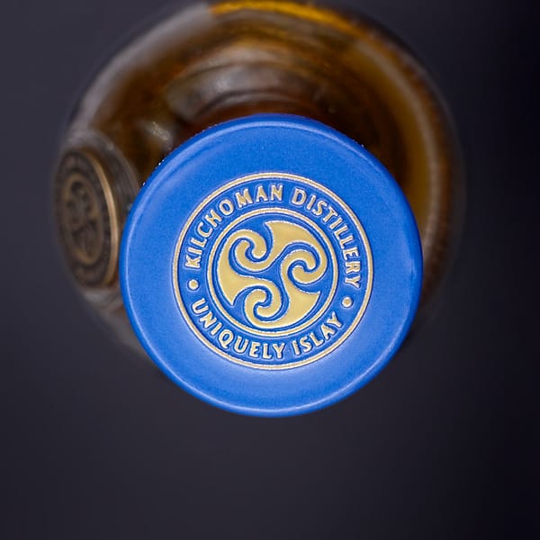 Kilchoman Machir Bay cap seal showing the distillery's triskelion logo