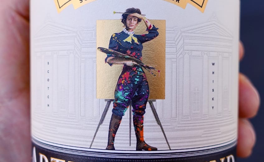 Detail of Compass Box Artist Blend label, showing a painter in front of Edinbourgh's Scottish National Gallery