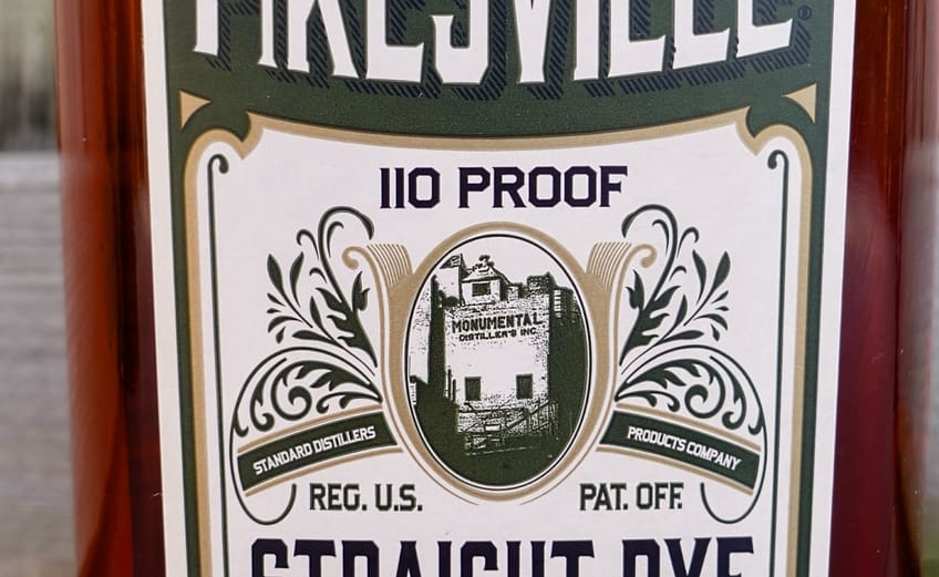 Pikesville Straight Rye Whiskey Bottle Label showing the 110 proof and an image of Monumental Distillery which produced the whisky until 1972