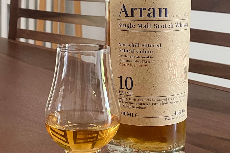 Picture of an Arran 10 year old bottle with a Glencairn glass containing a dram of the whisky