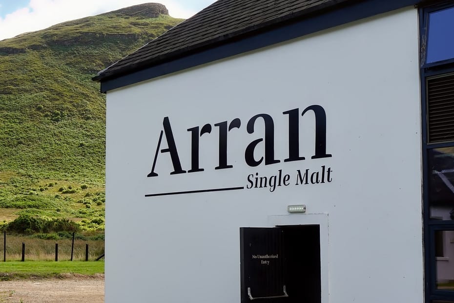 Lochranza distillery external wall with Arran logo