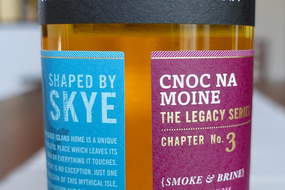 Torabhaing Cnoc Na Moine label made up of three paper panel leaving a negative space capital T in the middle