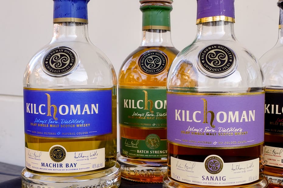 Kilchomans standard lineup of whisky bottles, from L to R, Machir Bay, Batch Strength, Sanaig