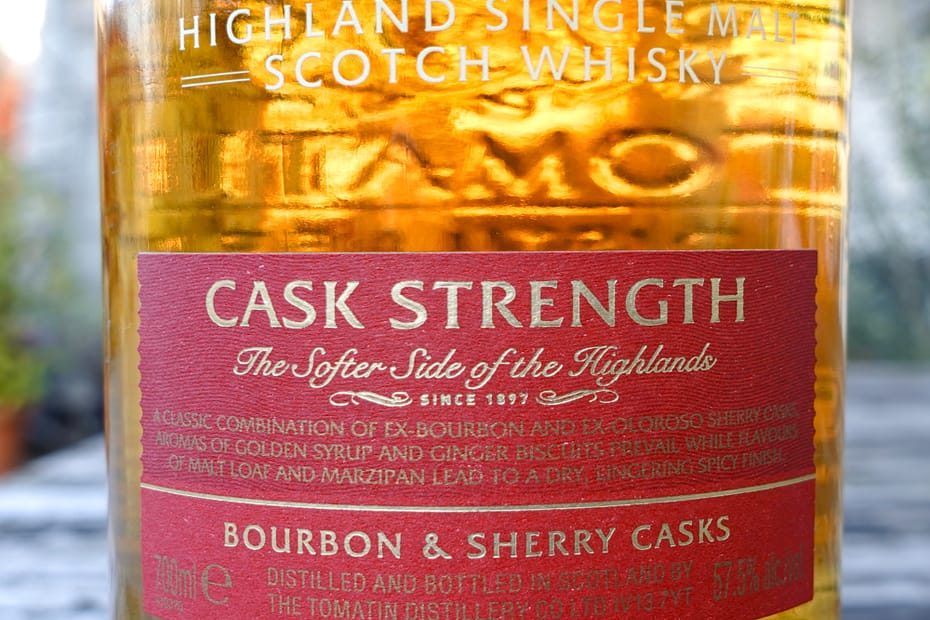 Front label detail of the Tomatin Cask Strength single malt bottle, highlighting the ageing in Bourbon and Sherry casks