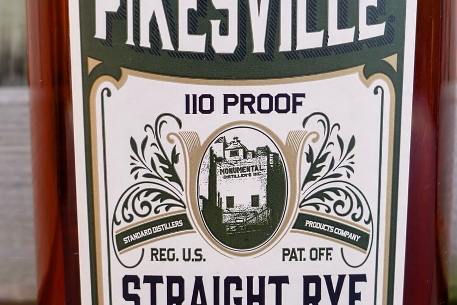 Pikesville Straight Rye Whiskey Bottle Label showing the 110 proof and an image of Monumental Distillery which produced the whisky until 1972