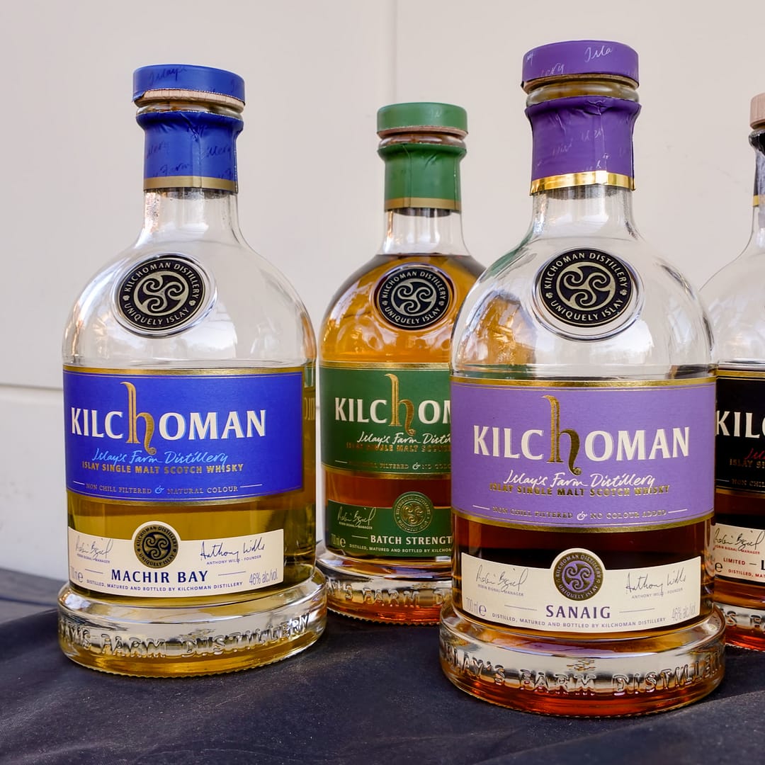 Kilchomans standard lineup of whisky bottles, from L to R, Machir Bay, Batch Strength, Sanaig
