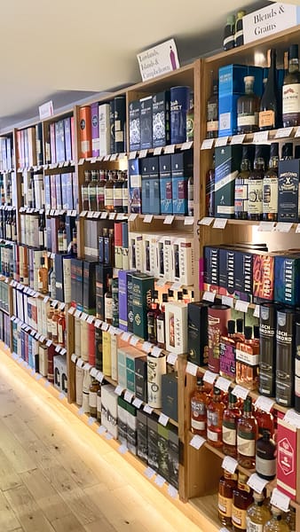 Some of the whisky selection at Glasgow's Good Spirit Company - showing shelves stacked with whisky bottles