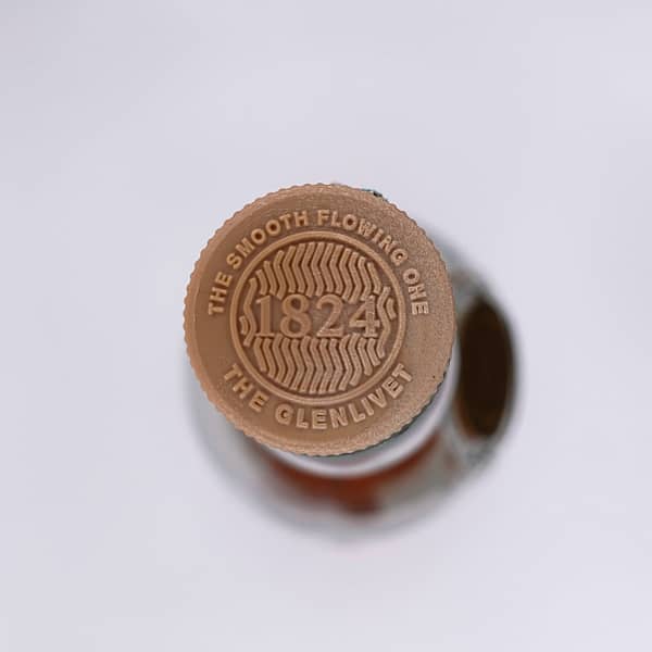 Picture of the Glenlivet 12 Double Oak cap showing the "smooth flowing one" motto