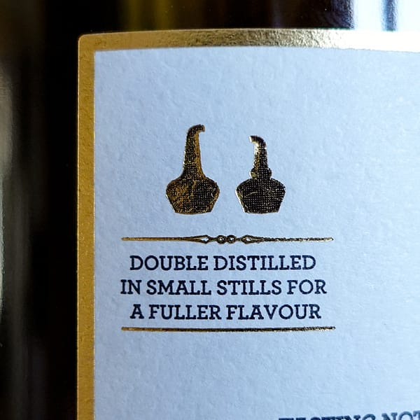 Wolfburn Morven back label detail showing an outline of the distillery's stills