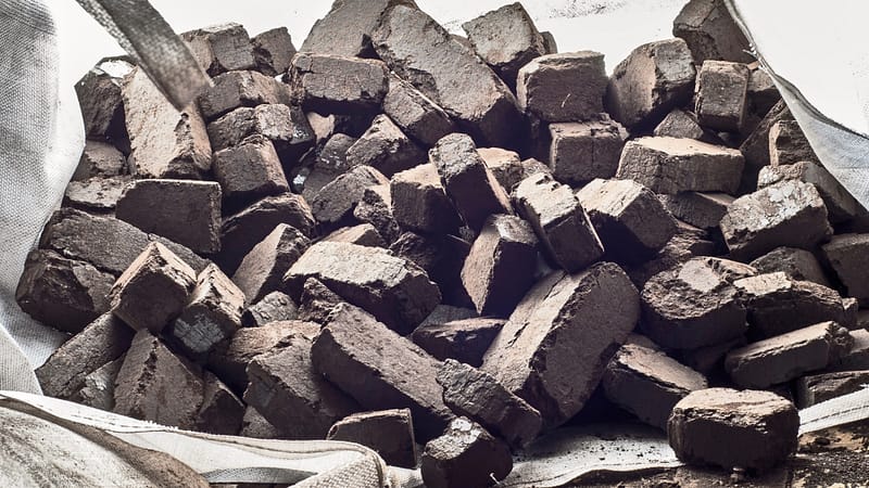 Cut peat bricks laying on a tarpaulin