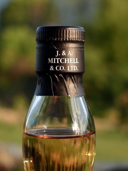 Springbank 100 proof 5 year old neck seal with the J&A Mitchel distillery owner branding